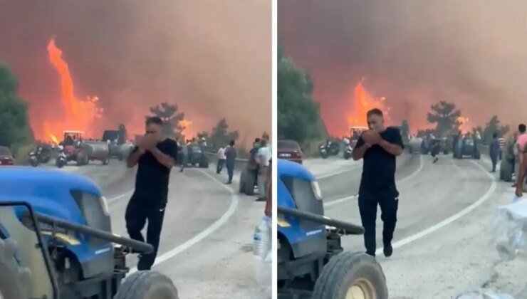 Alevlerin ortasında tepki çeken görüntüler! Orman kül olurken, o sigara yaktı