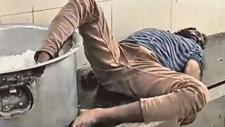 Öğrenci yurdunda çalışan sarhoş bekçi ayağı pirinç kazanı içinde uyurken yakalandı